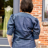 Elbow sleeve with frayed collar