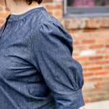 Elbow sleeve with frayed collar