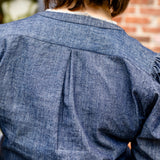 Elbow sleeve with frayed collar