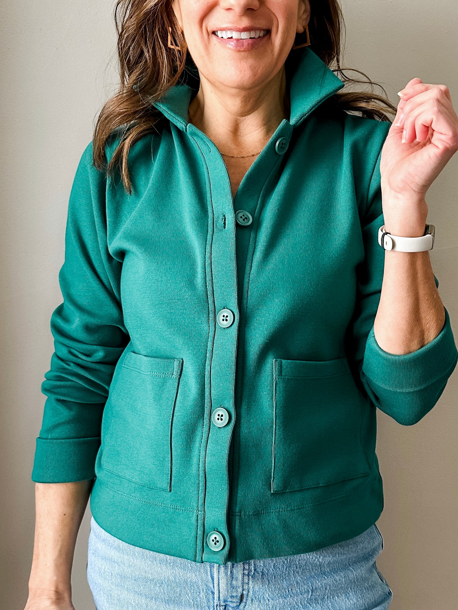 Versatile women's layering piece with a slightly boxy fit, crafted from soft 100% cotton surplus knit ribbed fabric. Features revised lower chest pockets, matching front buttons, and a stylish shirt collar. Medium-weight design hits at the waist or slightly below for a flattering fit.