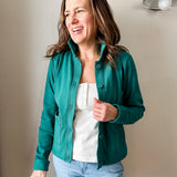Versatile women's jacket with front pockets and a slightly boxy fit, crafted from soft 100% cotton surplus knit ribbed fabric. Features revised lower chest pockets, matching front buttons, and a stylish shirt collar. Medium-weight design hits at the waist or slightly below for a flattering fit.