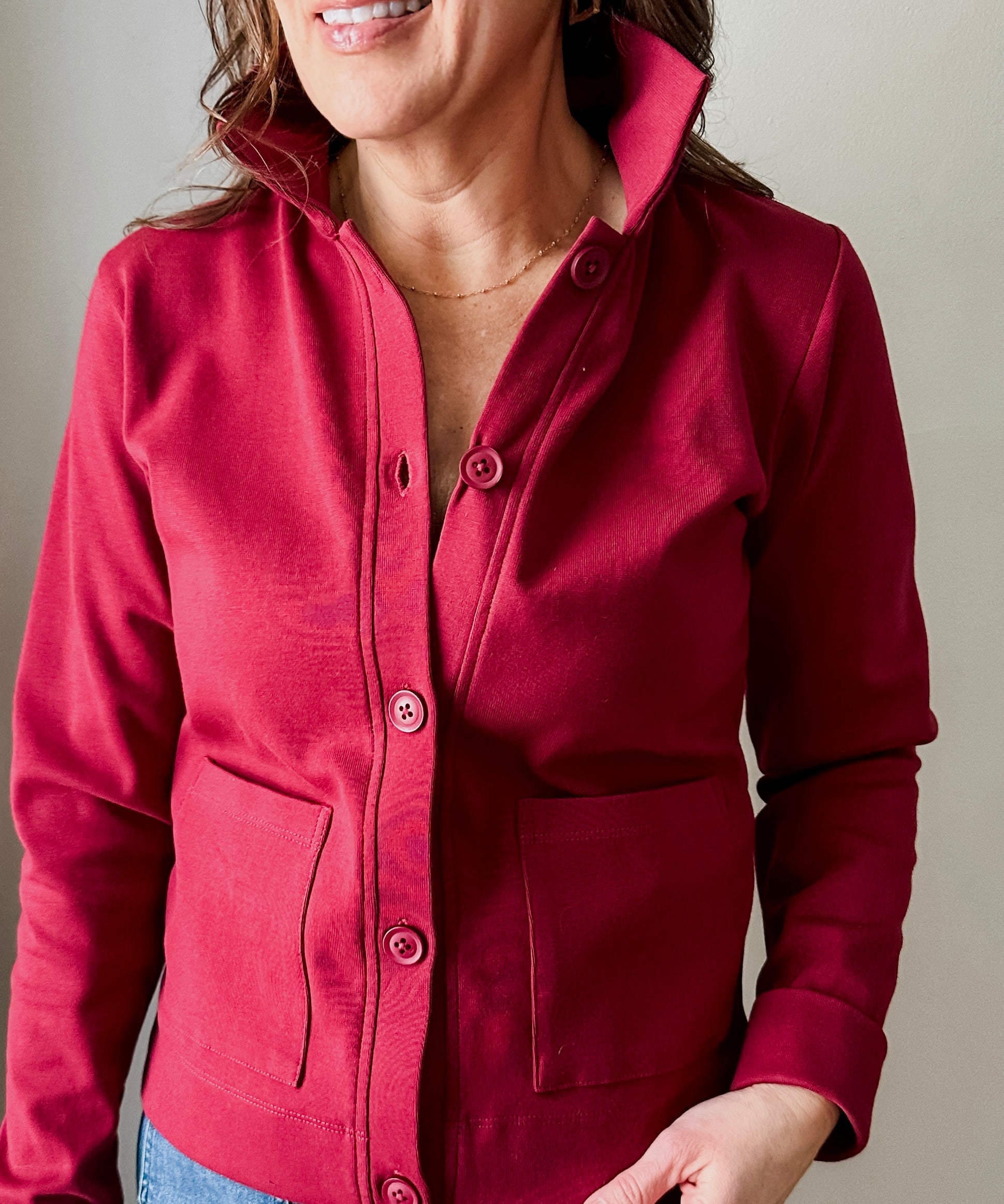 Versatile midweight women's jacket with front pockets and a slightly boxy fit, crafted from soft 100% cotton surplus knit ribbed fabric. Features revised lower chest pockets, matching front buttons, and a stylish shirt collar.