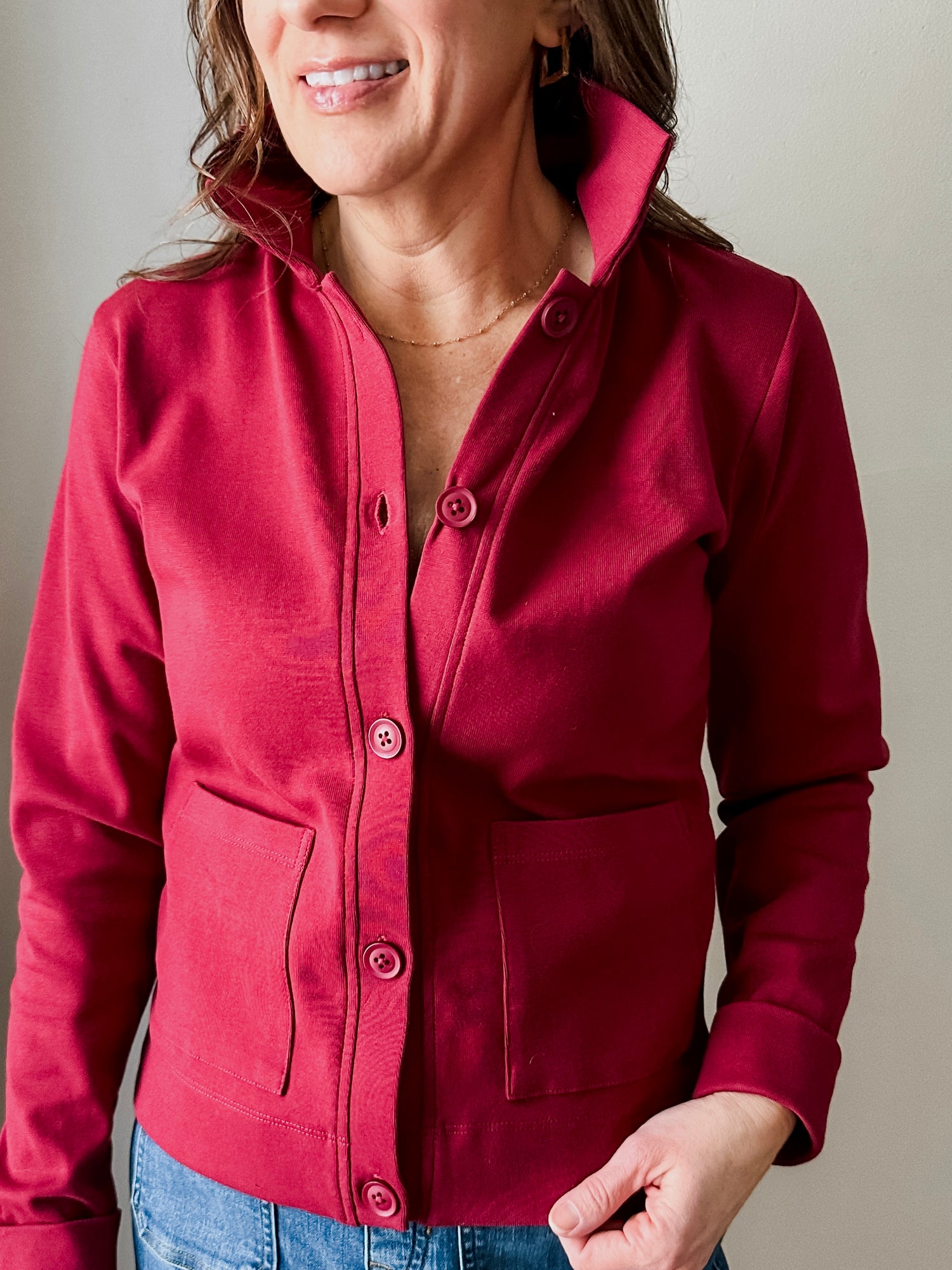 Versatile midweight women's jacket with front pockets and a slightly boxy fit, crafted from soft 100% cotton surplus knit ribbed fabric. Features revised lower chest pockets, matching front buttons, and a stylish shirt collar.