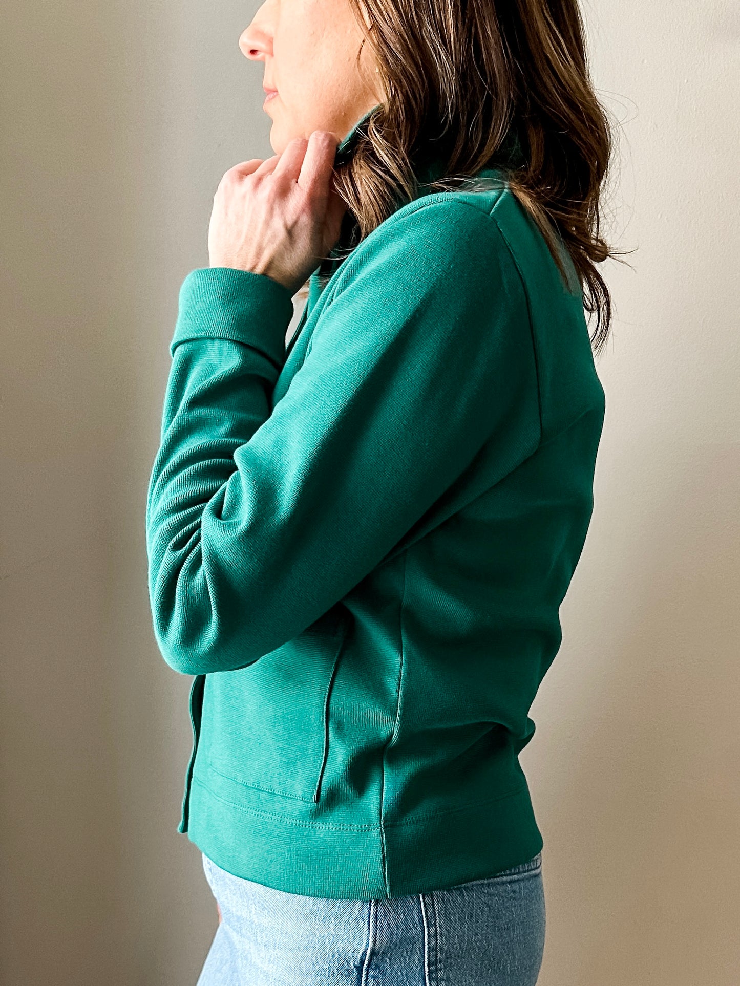 Versatile women's jacket with front pockets and a slightly boxy fit, crafted from soft 100% cotton surplus knit ribbed fabric. Features revised lower chest pockets, matching front buttons, and a stylish shirt collar. Medium-weight design hits at the waist or slightly below for a flattering fit.