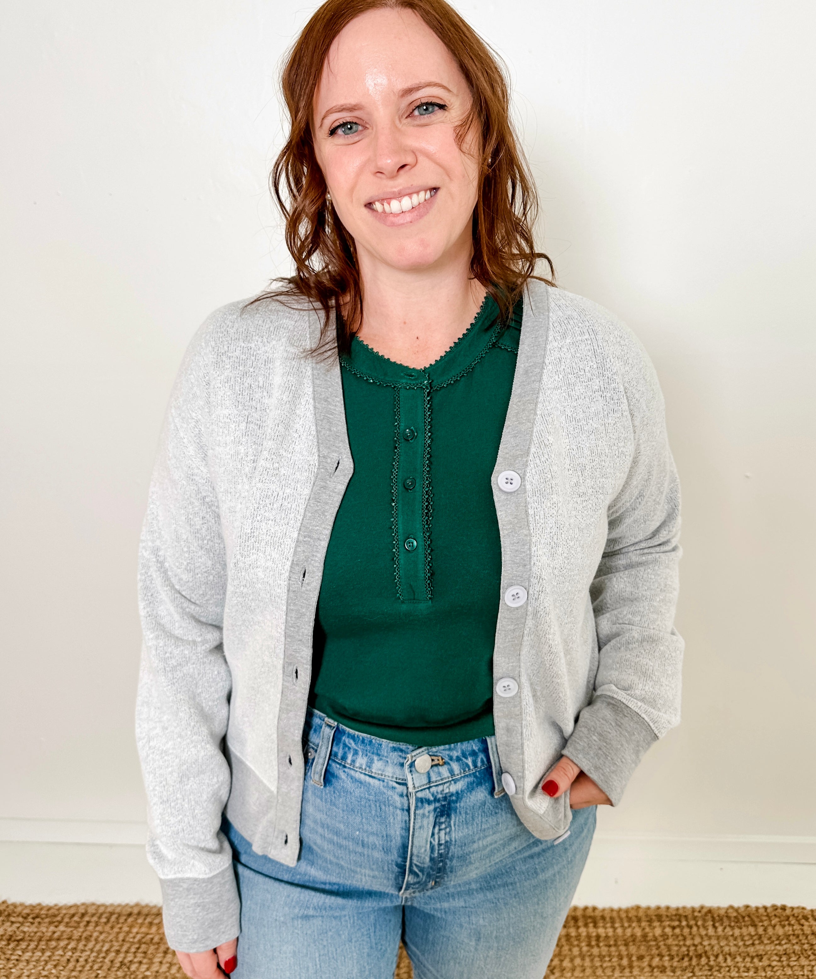 Women's button-front cardigan in lightweight knit fleece cotton blend, available in light grey. Features matching ribbed trims, classic fit, drop-shoulder long sleeves, banded hem & cuffs, and matching buttons. Light-medium weight fabric with slight stretch. Versatile styling. Available in XS-3X.
