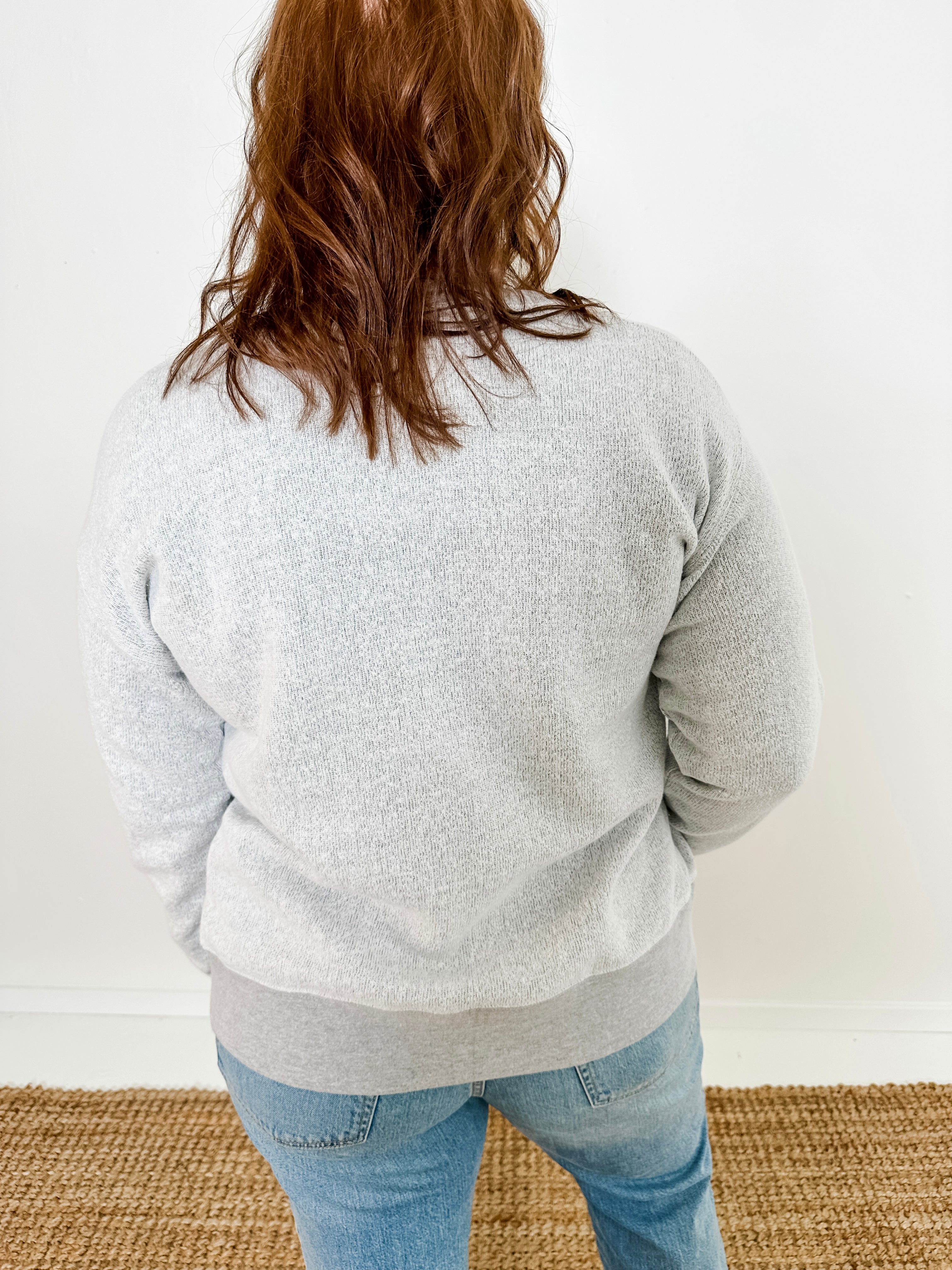 Women's button-front cardigan in lightweight knit fleece cotton blend, available in light grey. Features matching ribbed trims, classic fit, drop-shoulder long sleeves, banded hem & cuffs, and matching buttons. Light-medium weight fabric with slight stretch. Versatile styling. Available in XS-3X.