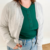 Women's button-front cardigan in lightweight knit fleece cotton blend, available in light grey. Features matching ribbed trims, classic fit, drop-shoulder long sleeves, banded hem & cuffs, and matching buttons. Light-medium weight fabric with slight stretch. Versatile styling. Available in XS-3X.