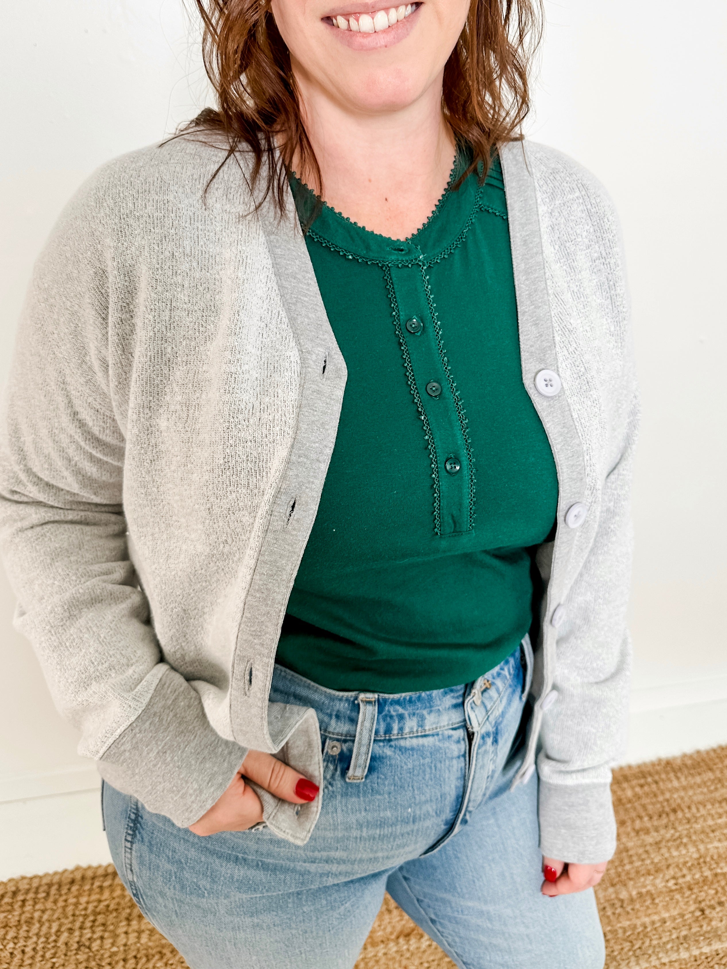 Women's button-front cardigan in lightweight knit fleece cotton blend, available in light grey. Features matching ribbed trims, classic fit, drop-shoulder long sleeves, banded hem & cuffs, and matching buttons. Light-medium weight fabric with slight stretch. Versatile styling. Available in XS-3X.