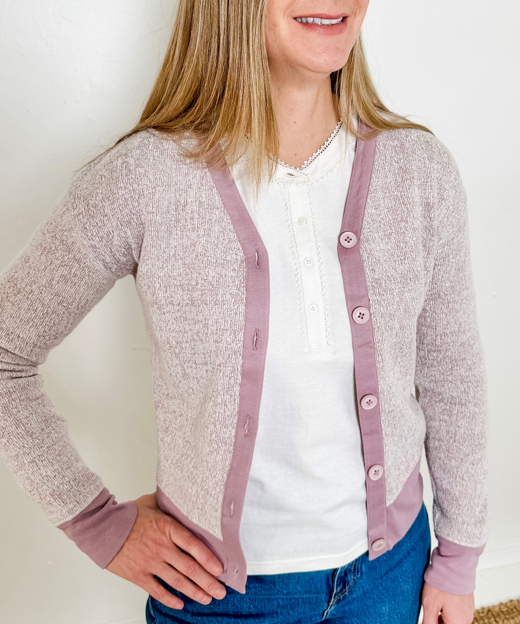 Women's button-front cardigan in lightweight knit fleece cotton blend, available in heathered lavender. Features matching ribbed trims, classic fit, drop-shoulder long sleeves, banded hem & cuffs, and matching buttons. Light-medium weight fabric with slight stretch. Versatile styling. Available in XS-3X.