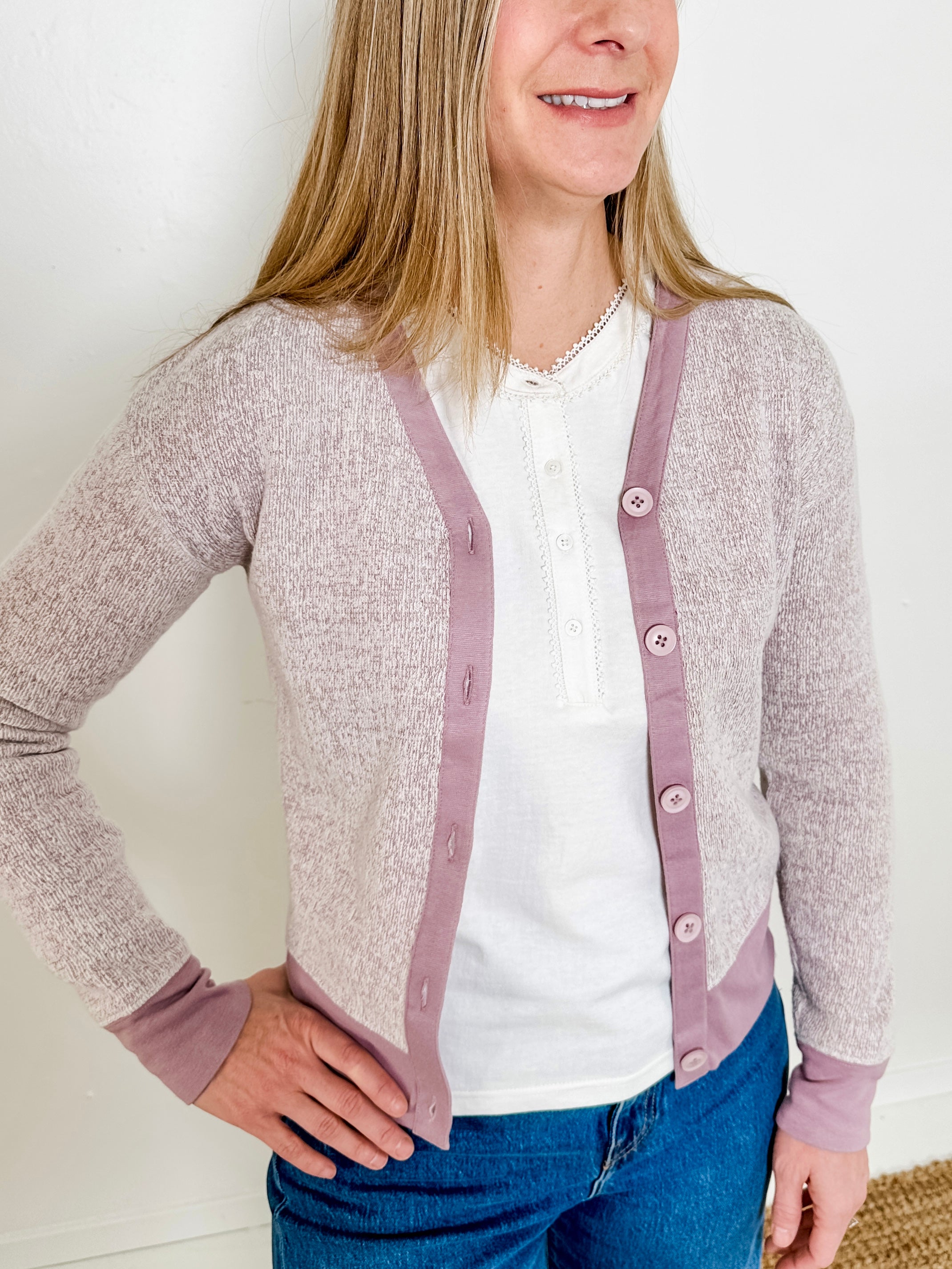 Women's button-front cardigan in lightweight knit fleece cotton blend, available in heathered lavender. Features matching ribbed trims, classic fit, drop-shoulder long sleeves, banded hem & cuffs, and matching buttons. Light-medium weight fabric with slight stretch. Versatile styling. Available in XS-3X.