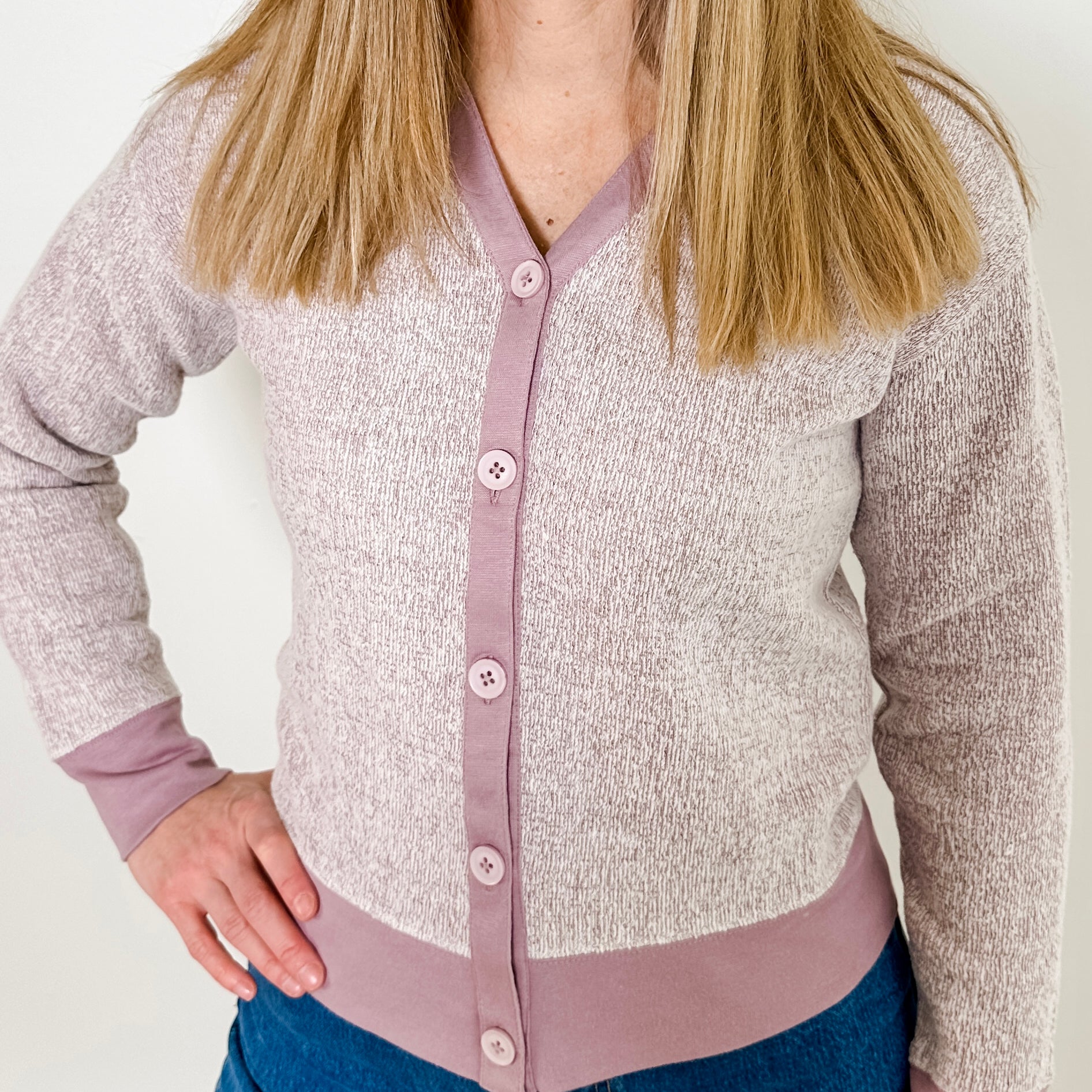 Women's button-front cardigan in lightweight knit fleece cotton blend, available in heathered lavender. Features matching ribbed trims, classic fit, drop-shoulder long sleeves, banded hem & cuffs, and matching buttons. Light-medium weight fabric with slight stretch. Versatile styling. Available in XS-3X.