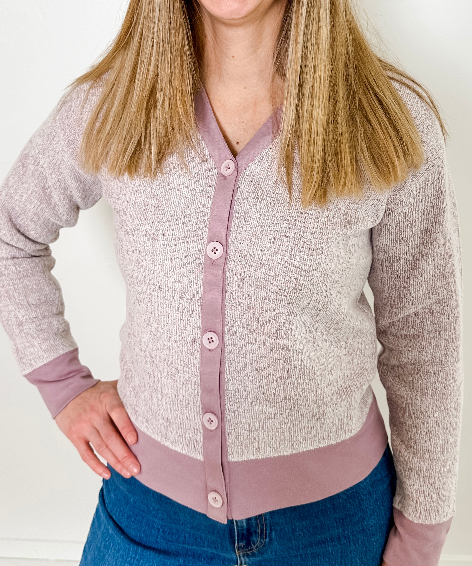 Women's button-front cardigan in lightweight knit fleece cotton blend, available in heathered lavender. Features matching ribbed trims, classic fit, drop-shoulder long sleeves, banded hem & cuffs, and matching buttons. Light-medium weight fabric with slight stretch. Versatile styling. Available in XS-3X.