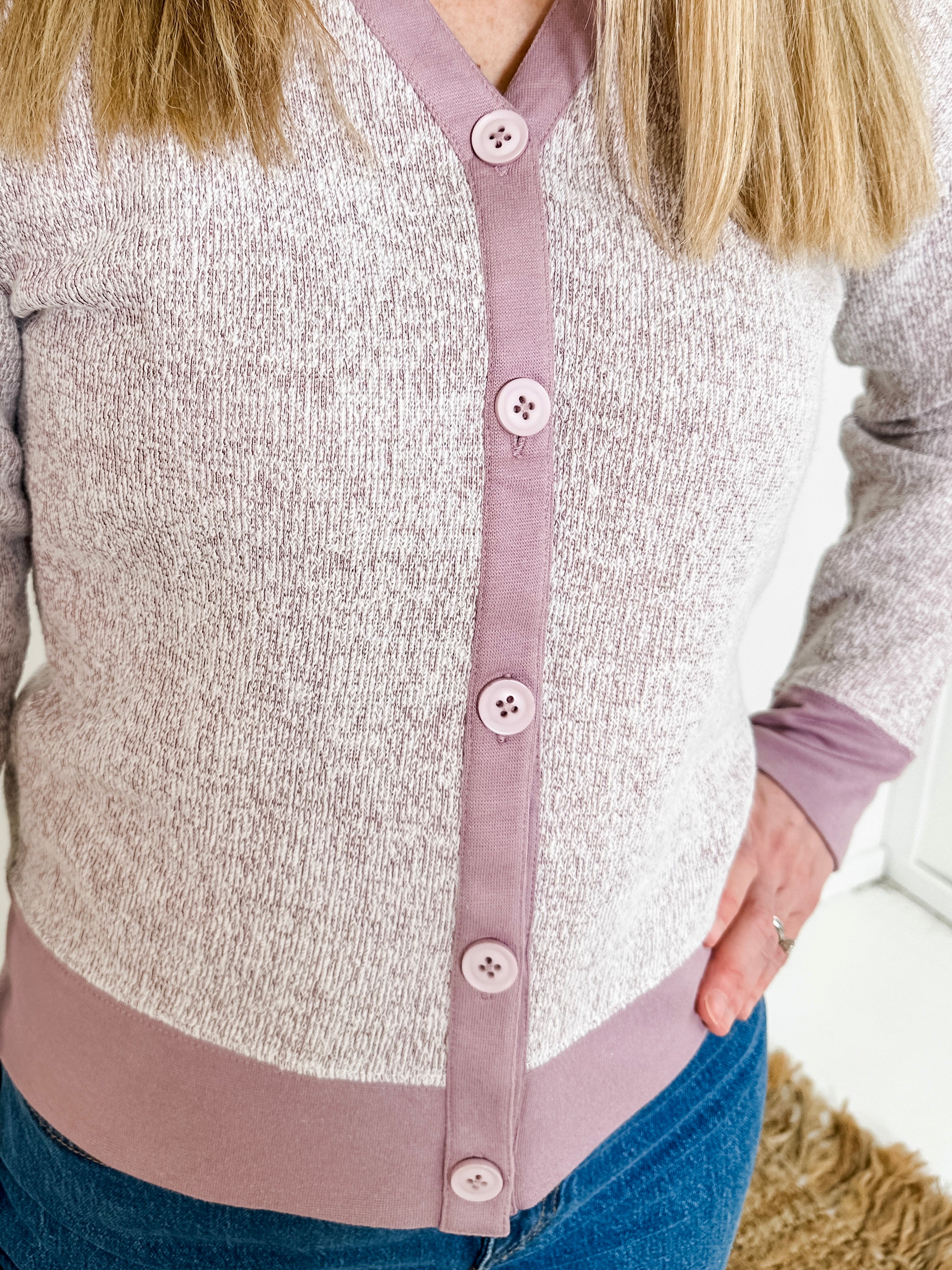 Women's button-front cardigan in lightweight knit fleece cotton blend, available in heathered lavender. Features matching ribbed trims, classic fit, drop-shoulder long sleeves, banded hem & cuffs, and matching buttons. Light-medium weight fabric with slight stretch. Versatile styling. Available in XS-3X.