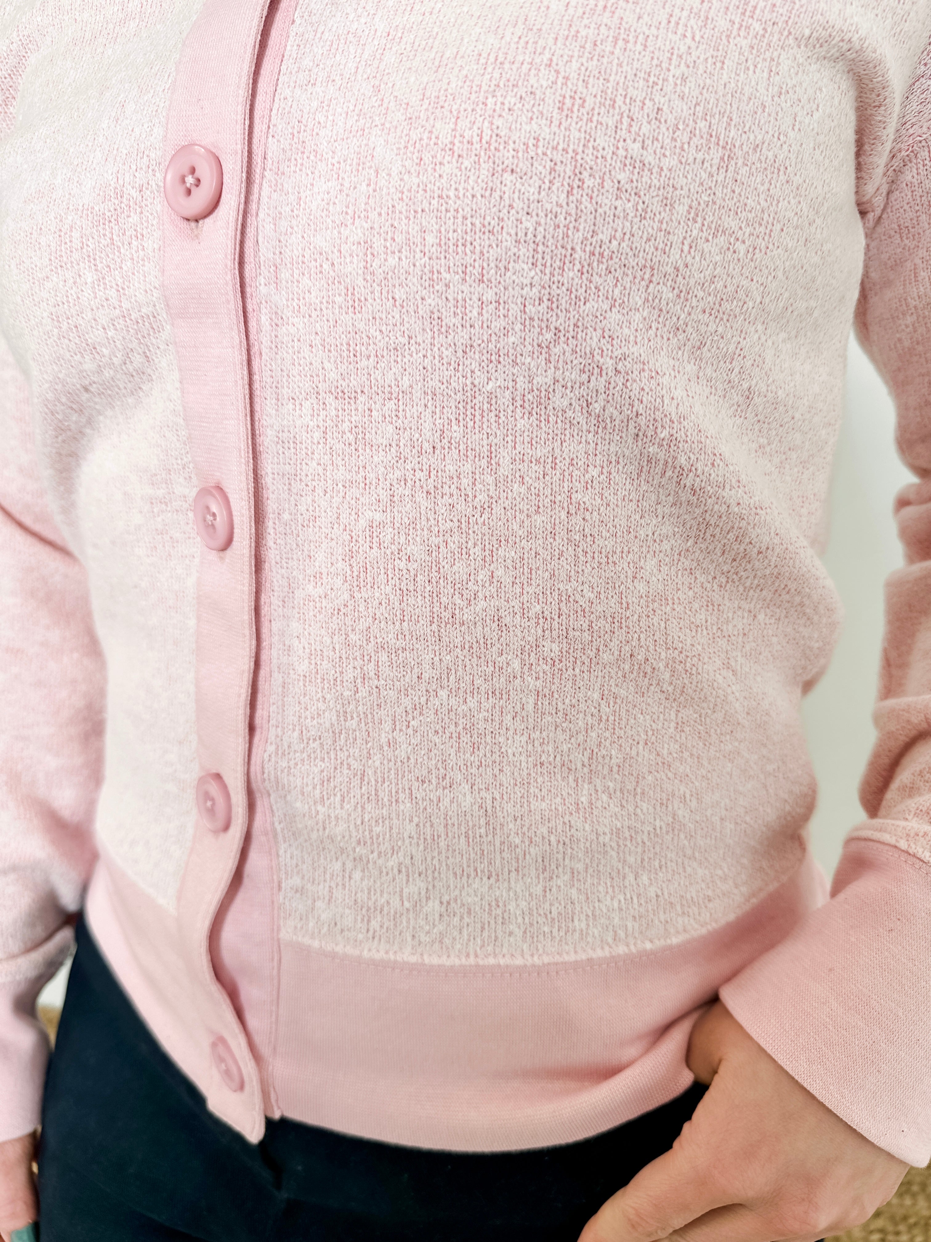 Women's button-front cardigan in lightweight knit fleece cotton blend, available in light pink. Features matching ribbed trims, classic fit, drop-shoulder long sleeves, banded hem & cuffs, and matching buttons. Light-medium weight fabric with slight stretch. Versatile styling. Available in XS-3X.