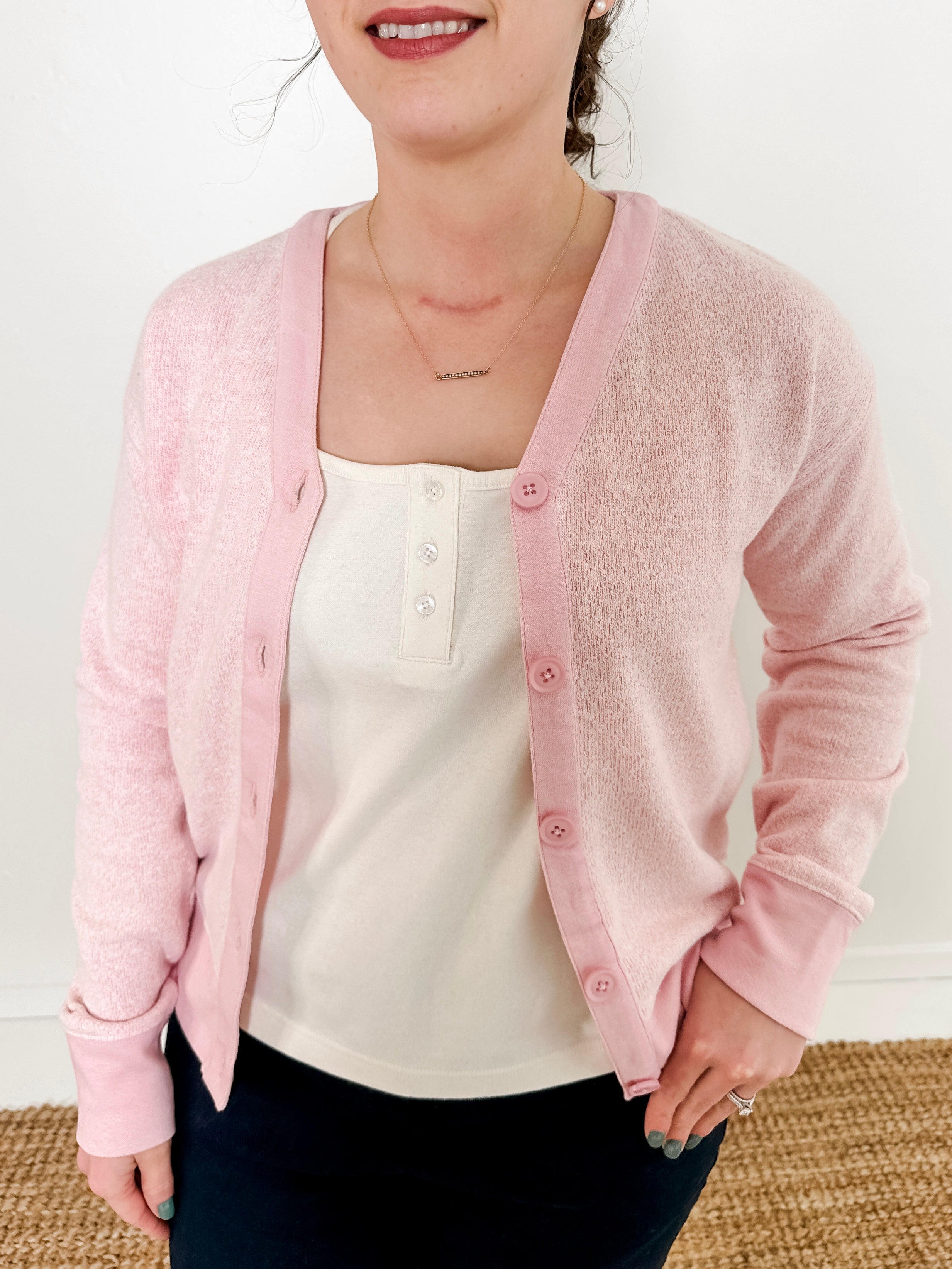 Women's button-front cardigan in lightweight knit fleece cotton blend, available in light pink. Features matching ribbed trims, classic fit, drop-shoulder long sleeves, banded hem & cuffs, and matching buttons. Light-medium weight fabric with slight stretch. Versatile styling. Available in XS-3X.