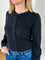 Women's knit blouse with lace detail, made from 100% cotton jersey surplus fabric. Available in black. Features a collarless band neckline, matching button-front placket, delicate knit lace on shoulders, collar, cuffs, and placket, keyhole buttoned cuffs, and side slits. Medium-weight fabric with light stretch for a straight fit. Available in sizes XS-3X.