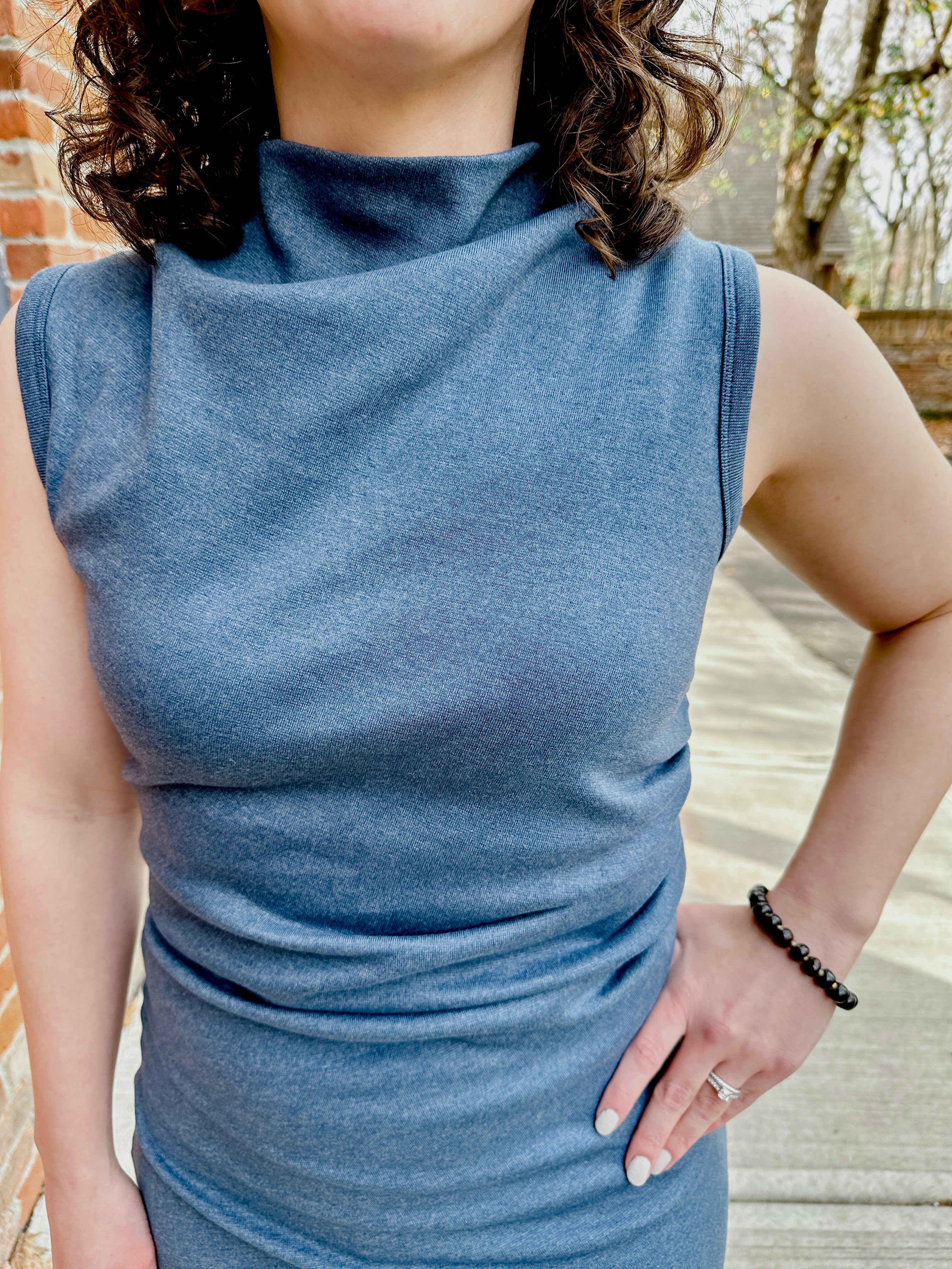 Soho Dress – Chic & Versatile Women’s Dress – Flattering Ruched Waist for All Sizes and Body Types – Short Draped Cowl Mock Neckline for a Sophisticated Look – Made from Soft Surplus 100% Cotton Knit 1x1 Fabric – Medium Weight with Light Stretch for Smooth, Comfortable Wear – Sleeveless Design with Cuff Trim – Tidy Back Zipper for Easy Styling – Available in 4 Colors: blue, Sizes XS-3X – Perfect to Pair with a Cardigan, Sherpa Jacket, or Knit Blazer – effortless and stylish.